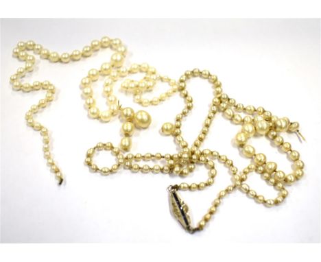 TWO PEARL STRANDS WITH 9CT CLASP To include a strand of cultured pearls 40cm long (clasp missing) and a strand of imitation p