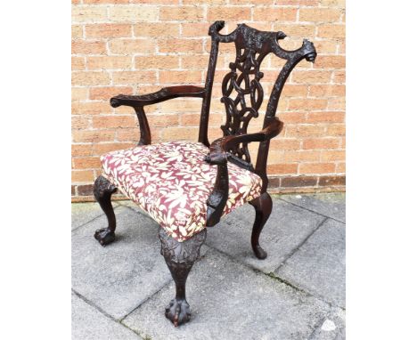A CHIPPENDALE STYLE CARVED MAHOGANY CARVER CHAIR  19th century, decorated with flower heads, swags, acorns and oak leaves, th