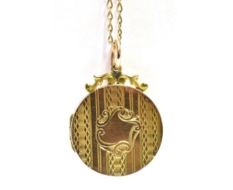 9CT GOLD LOCKET &amp; CHAIN 24.1mm diameter round locket decorated with linear engine turning and a scroll framed, blank cart