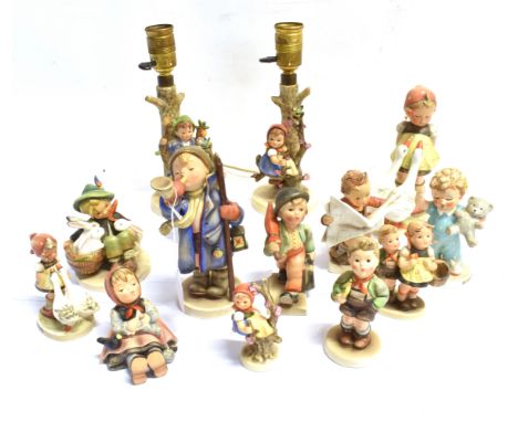 FOURTEEN GOEBEL HUMMEL FIGURINES  including a pair of table lamp bases, the largest 18.5cm high (excluding fittings). Conditi