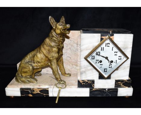 AN ART DECO MARBLE CASED MANTLE CLOCK  with a patinated spelter figure of an alsatian dog, the French 8-day movement stamped 