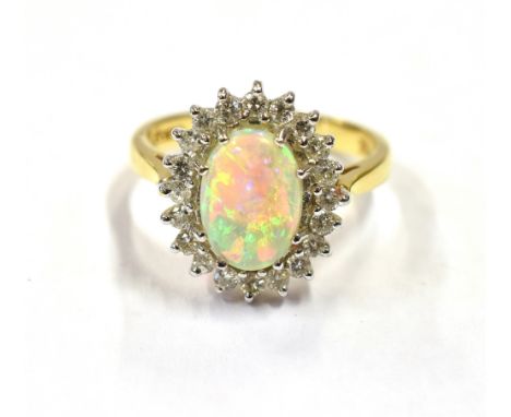 18CT OPAL &amp; DIAMOND HALO RING White gold claw set white opal cabochon, with very good play of colour, estimated 1.2 carat