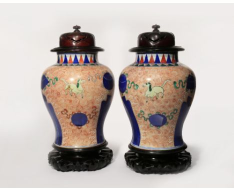 A PAIR OF CHINESE WUCAI BALUSTER VASES 19TH CENTURY Painted in underglaze blue and coloured enamels with horses galloping ami