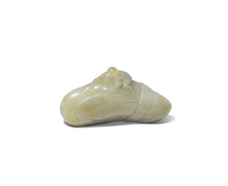 A CHINESE CELADON JADE CARVING OF A MONKEY ON A BOULDER QING DYNASTY Formed as the primate clambering over towards two butter