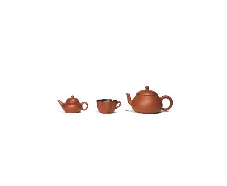 A CHINESE YIXING TEAPOT AND COVER QING DYNASTY Of plain ovoid form, the base inscribed with the signature Jing xi Chen Wan Yu