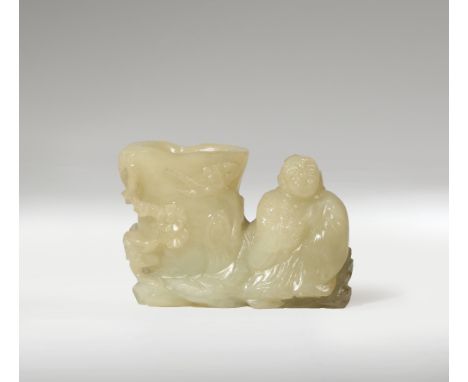 A SMALL CHINESE PALE CELADON JADE VASE QING DYNASTY Formed as a smiling robed figure seated next to the vessel, with prunus, 