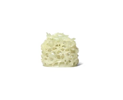 A CHINESE PALE CELADON JADE 'DRAGON' HAT FINIAL PROBABLY MING DYNASTY Deeply carved in openwork with a dragon clambering amid