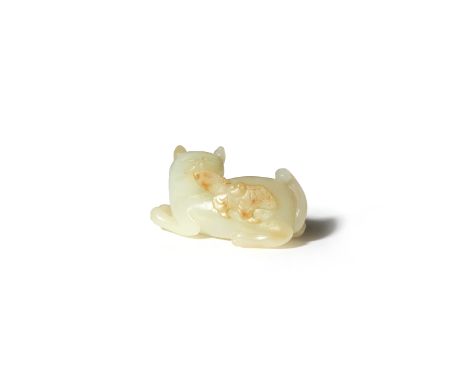 A CHINESE PALE CELADON JADE CARVING OF A CAT AND BUTTERFLY QING DYNASTY The feline depicted crouching turning its head left t