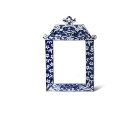 A CHINESE BLUE AND WHITE FRAME 19TH CENTURY Formed as a roofed building, painted with two dragons contesting a flaming pearl 