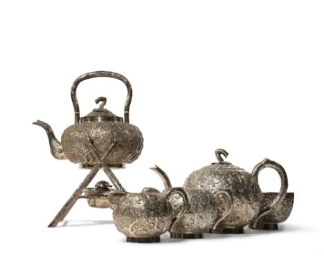 λ&nbsp;A CHINESE SILVER TEA SERVICE 19TH CENTURY Comprising: a kettle and cover, a teapot and hinged cover, a cream jug, a su