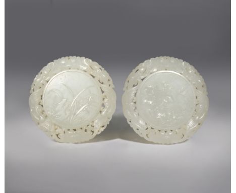 A PAIR OF CHINESE WHITE JADE CIRCULAR 'SI JUN ZI' PLAQUES QING DYNASTY OR LATER Finely carved in shallow relief with the Four