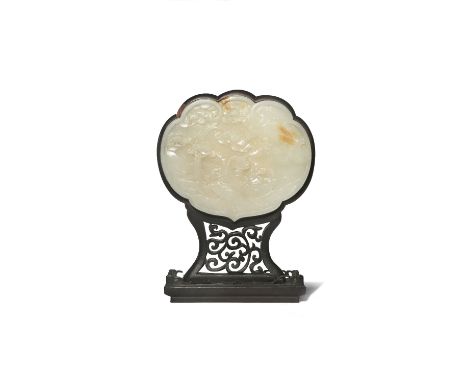 A CHINESE PALE CELADON JADE RUYI-HEAD SHAPED PLAQUE QING DYNASTY Carved in shallow relief to one side with a figure seated ne