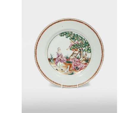 A CHINESE FAMILLE ROSE 'CHERRY PICKERS' PLATE C.1740 Depicting a young man up a ladder passing a fruit down to a maiden, a th
