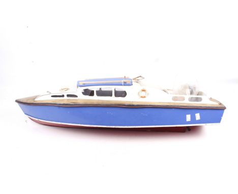 A scratch built model of a pleasure boat. With blue hull, red keel and white trim, with propeller and facility for electric m