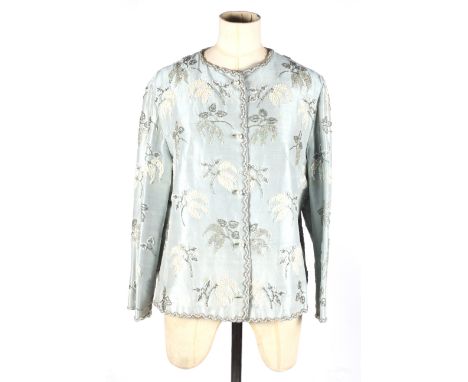 A vintage ladies evening jacket. Constructed of a light blue taffeta blend heavily embellished with sequins and beading with 