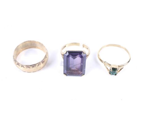 Three vintage rings. Comprising; a 9ct gold and canted-rectangular step-cut synthetic-corundum imitating amethyst single ston