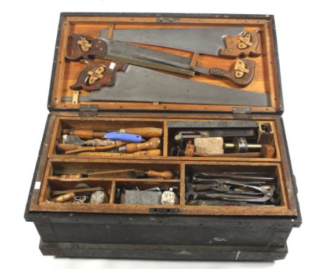 An early 20th century carpenter's tool chest and contents. Including a collection of assorted wood and metal working tools; j