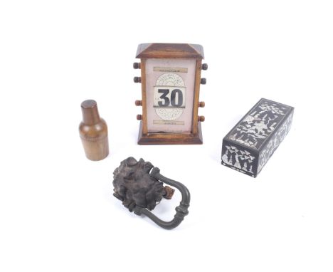 An assortment of vintage collectables. Including a perpetual desk calendar, metal door knocker and a mother of pearl inlaid b