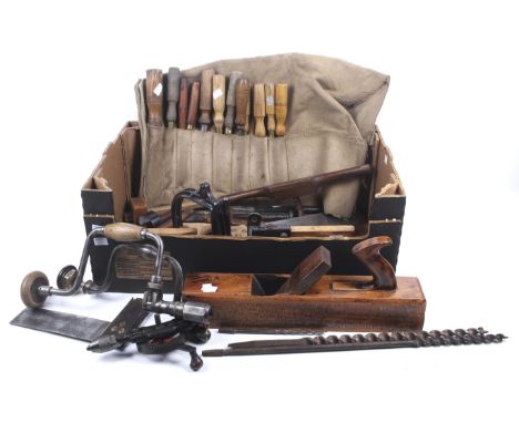 A collection of assorted vintage wood working hand tools. Including a set of chisels, shoulder chisels, bit and brace drills,