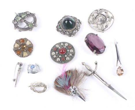 Twelve Scottish and Celtic brooches. In various Celtic and other designs including some stone set in the form of shields; a s