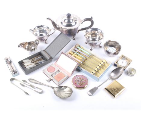 A collection of silver plate, boxes and compacts. Including a three piece round tea service with shaped borders, a sugar bowl