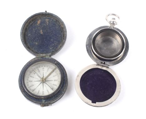 A leather bound pocket compass and plated and textured round fob case. The case enclosing a collapsible travel cup.  