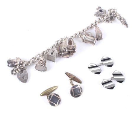 A vintage silver charm bracelet and two pairs of cufflinks. The charm bracelet with nine charms and a heart padlock clasp. 60