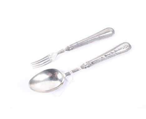 A Victorian silver christening fork and spoon with beaded handles. Mark of George Unite, Birmingham 1853, 60g gross 
