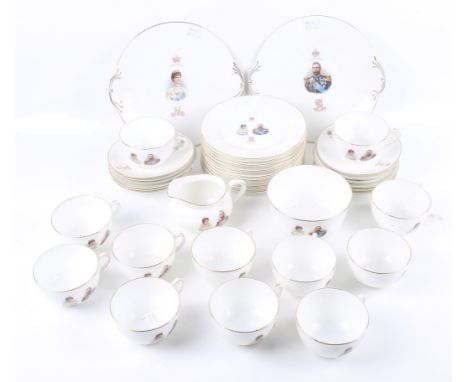 A Royal Doulton ten piece tea service celebrating the coronation of George V, comprising teacups and saucers, a cream jug, su
