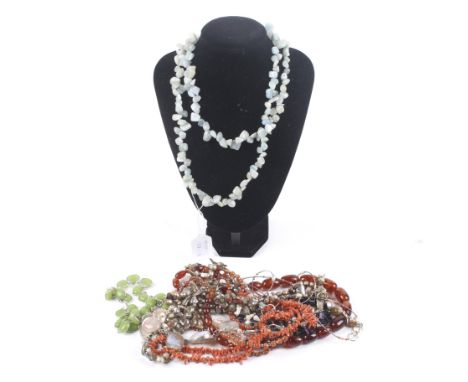 A collection of hardstone jewellery necklaces including a tumble polished amethyst. Branch coral; stained baroque freshwater-