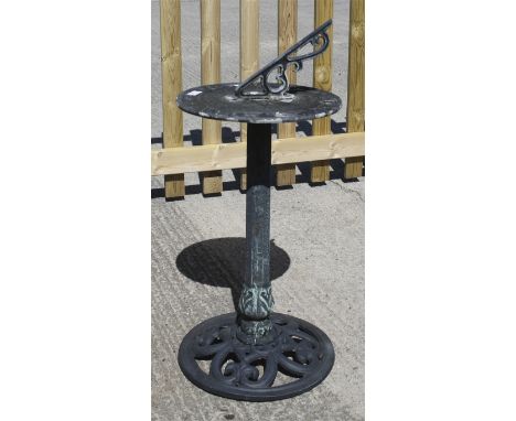 A cast metal sundial. On a circular stand with pierced decoration. Max. H82cm