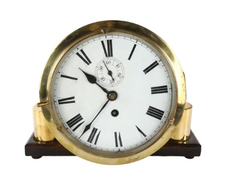 An Antique brass ship's bulkhead clock, white enamel dial with Roman numeral hour markers and subsidiary seconds dial, overal