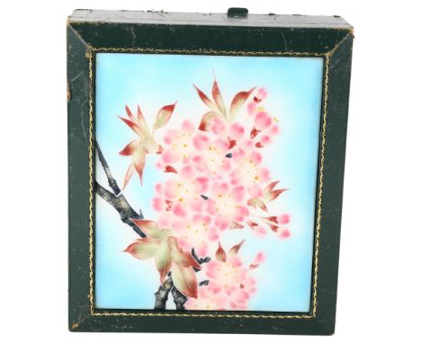 A green leather-bound jewel box, with floral enamel inset panel, 22cm x 19cmLeather is worn at the corners with several areas