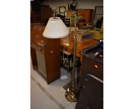 A modern brushed brass adjustable standard lamp good solid design