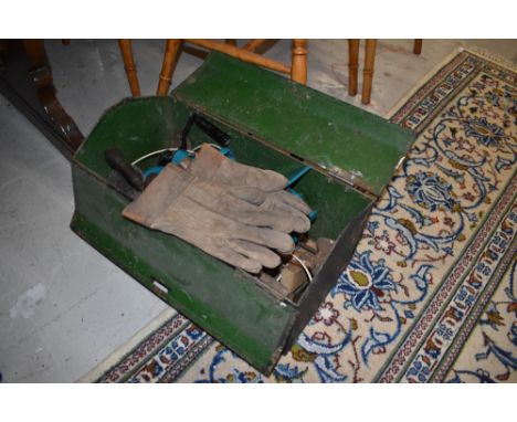 A metal tool chest having various tools and hammers