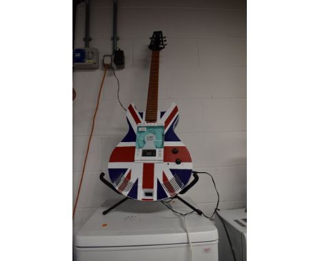 An Acura compact disk Hi Fi stereo system in the form of an electric guitar