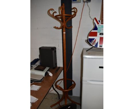 A steamed wood light stained cloak or coat stand