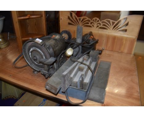 A bench grinder, vice etc