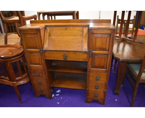 A 1930s oak bureau with side by side cupboards and book shelf under, nice proportions, width approx. 104cm