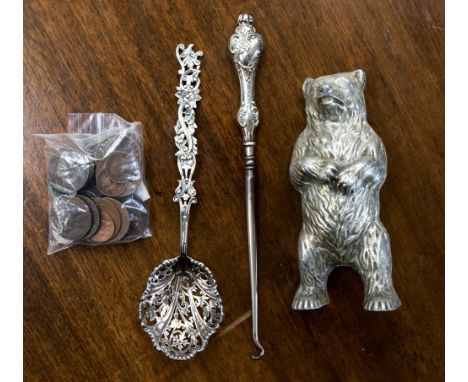 Silver spoon,silver mounted button hook, white metal Bear Money Box and a quantity of coins including three good tokens