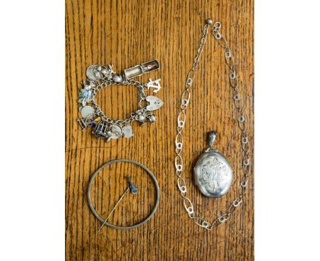 A collection of silver and white metal jewellery to include bangle, necklace, charm bracelet, pendant and pin. (5)