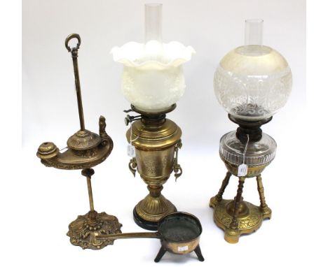 Three Victorian brass oil lamps, two with glass shades, another hand carry in Aladdin's lamp shape with an owl as a finial (3