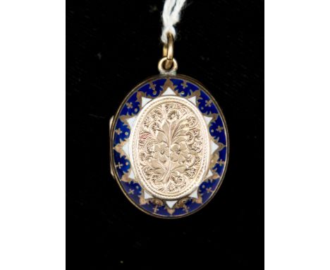 A Victorian yellow metal (probably 9ct gold) enamel locket with floral detail to the centre with blue and white enamel surrou