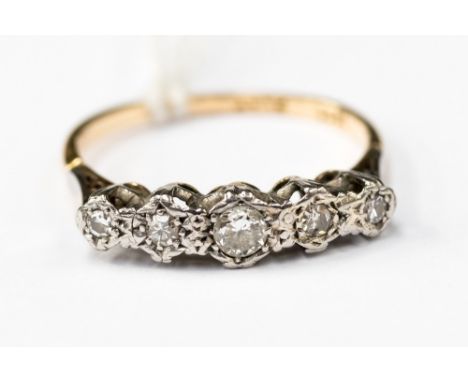 A five stone 18ct gold and platinum diamond ring, size N½  with a total gros weight of 2.3 gms