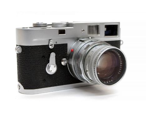 Leica: A cased Leica M2-1051613 DBP camera body marked 'Ernst Leitz GMBH, Wetzlar, Germany, together with a Leica lense marke