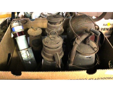 Two boxes of storm lanterns, a railway lantern, oil lamp, miners lamp and fire damp detector 