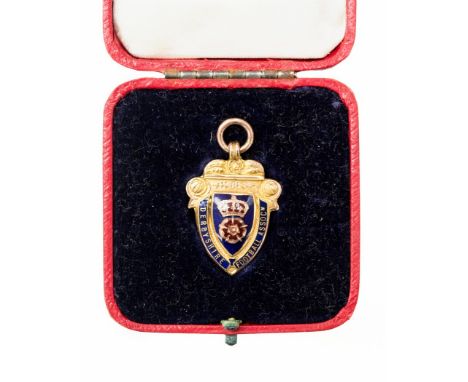 Football Medal: A 9ct gold 'Derbyshire Football Association' enamelled football medal, embossed to the reverse 'Medal Competi