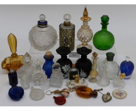 A collection of scent bottles including Mary Gregory style, cut glass, ceramic, moulded glass, etc 