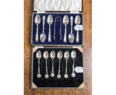 A cased set of six King George V teaspoons and sugar nips, Daniel & Arter Birmingham 1927, Rococo style together with six sil