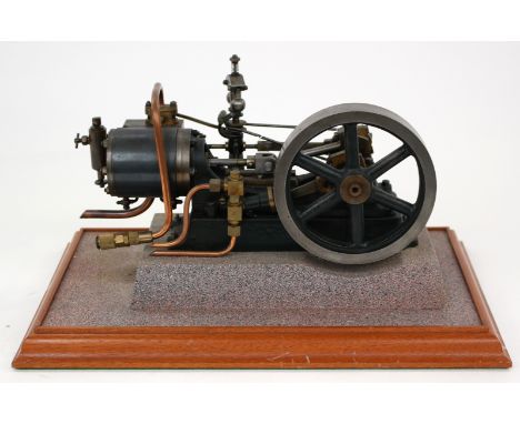 Stuart-Turner: A fine, hand-built Stuart-Turner steam engine, with a 5 ¼" flywheel mounted on stand, together with an accompa